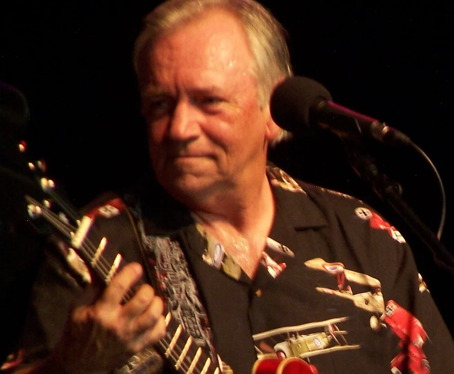 Barry Winslow playing guitar during a Las Vegas performance.
